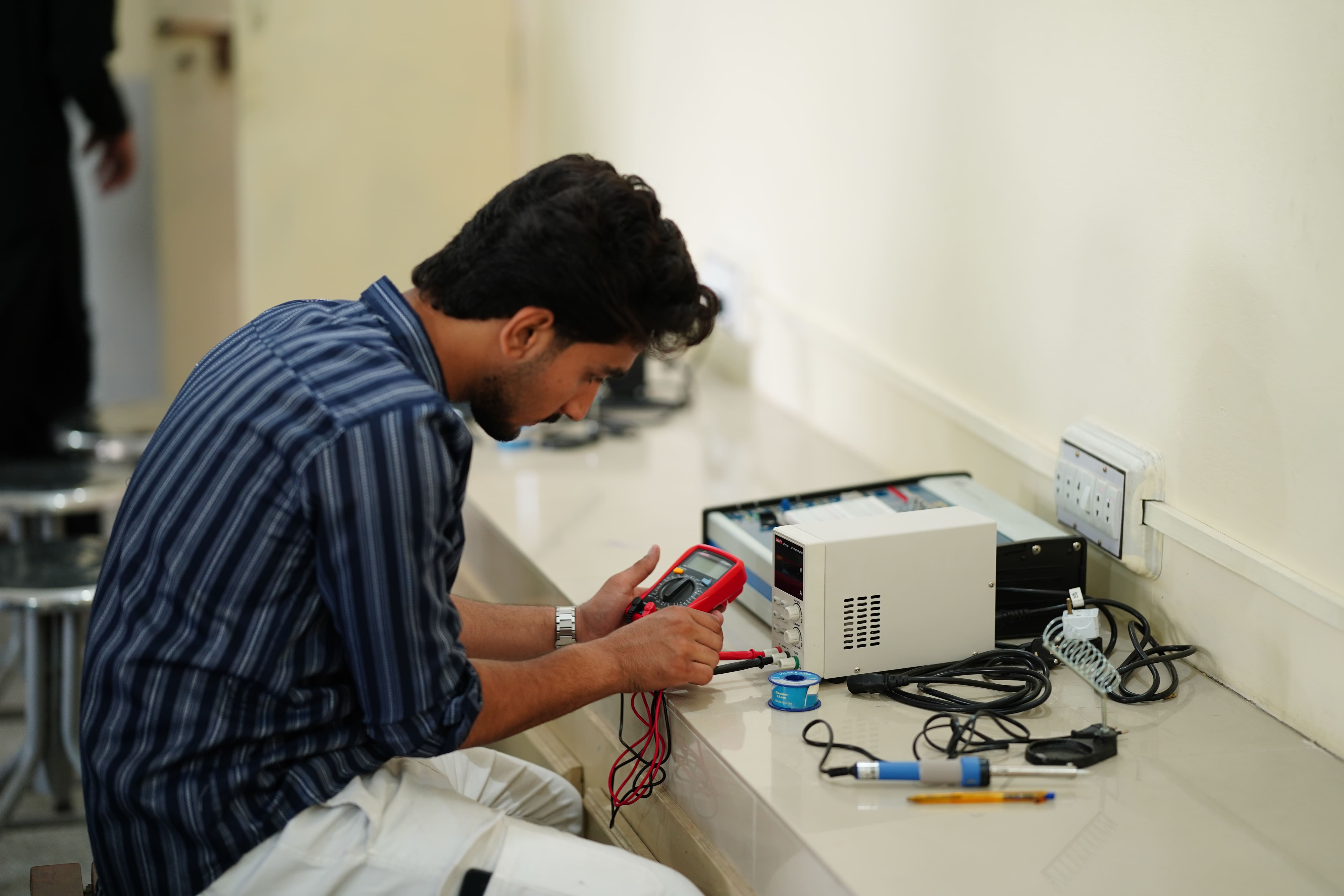 Student using Multimeter
